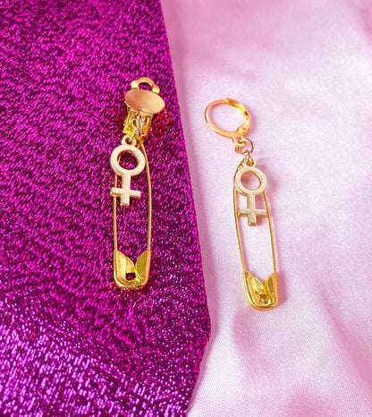 Gold safety pin and Venus charm earrings