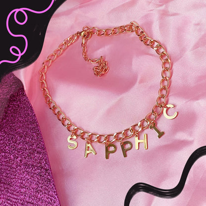 SAPPHIC gold colour letter charm necklace
