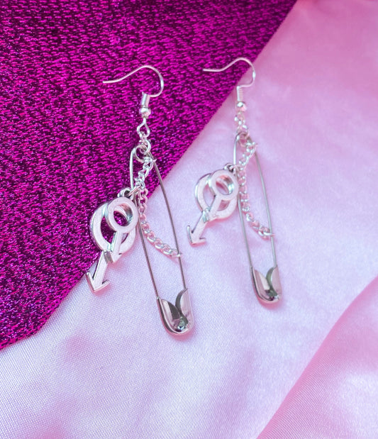 Safety pin earrings with Double mars charms