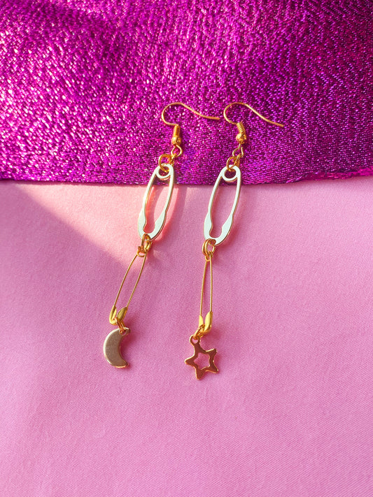 Gold safety pin with moon and star charm earrings