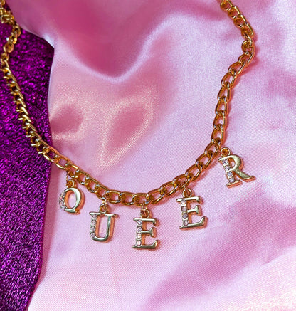 Diamanté QUEER gold colour letter charm necklace