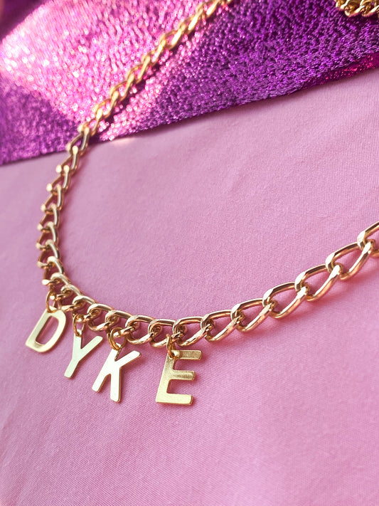 DYKE gold colour letter charm necklace