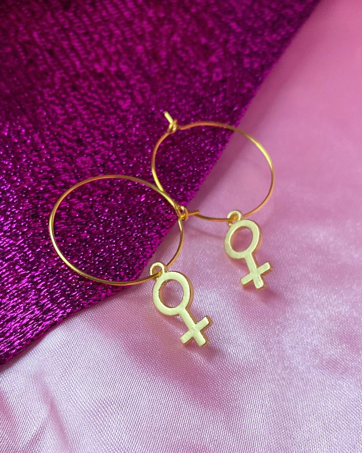 Gold Venus symbol hoop earrings