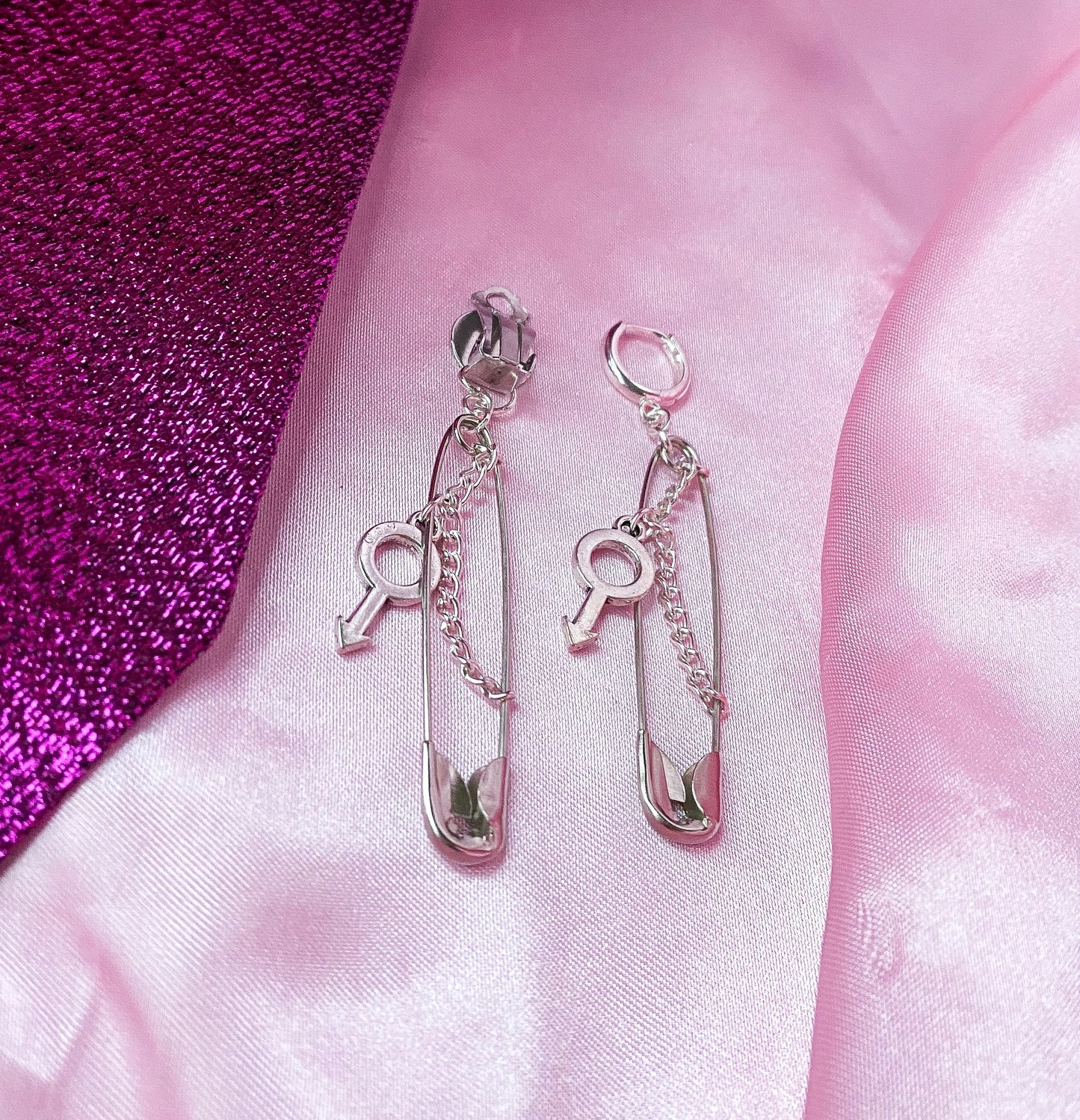Safety pin earrings with Mars symbol charm