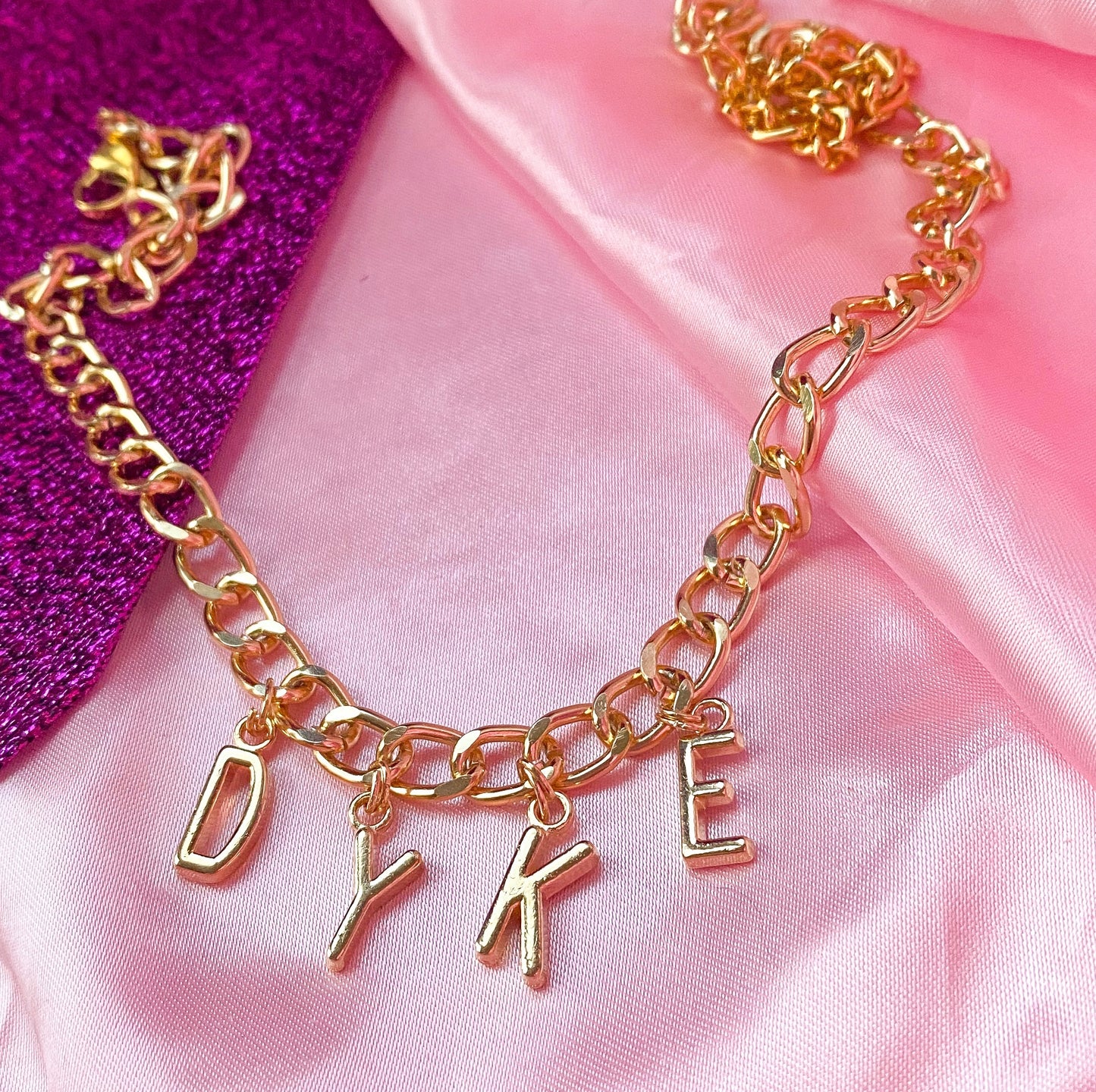 Chunky DYKE gold colour letter charm necklace