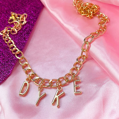 Chunky DYKE gold colour letter charm necklace