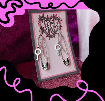 Safety pin earrings with Mars symbol charm