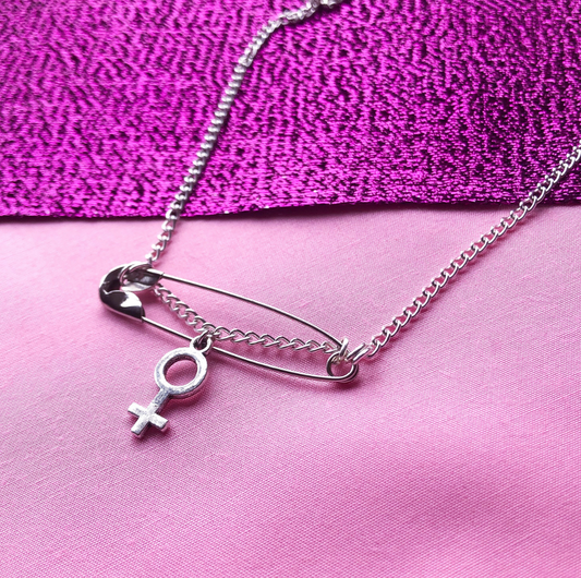 Safety pin necklace with venus symbol charm