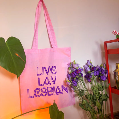 Live Lav Lesbian, pink tote bag with purple vinyl text. Leftbians Collab with Lavender Rodriguez