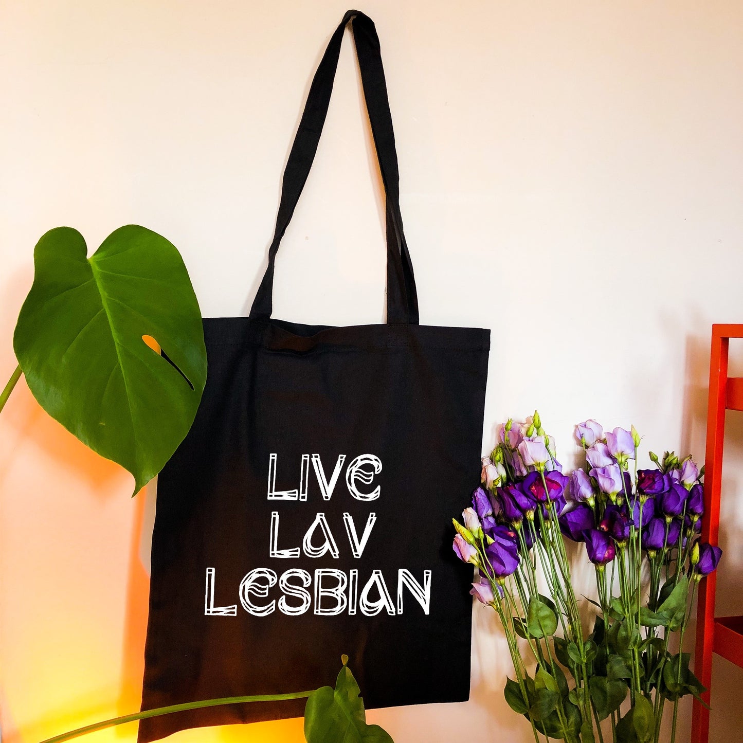 Live Lav Lesbian, black tote bag with white vinyl text. Leftbians Collab with Lavender Rodriguez