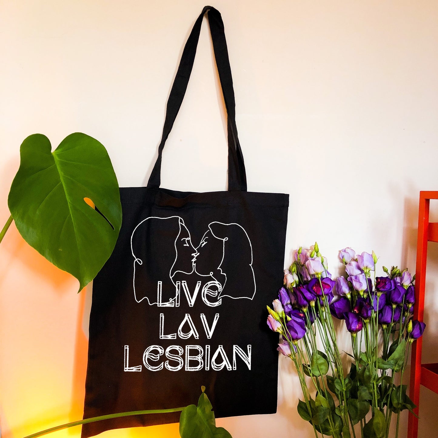 Liv Lav Lesbian, black tote bag with white vinyl text and image. Leftbians Collab with Lavender Rodriguez