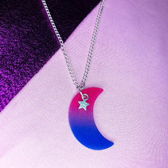 Bisexual flag colours on a crescent moon charm attached to a silver necklace chain