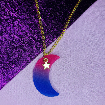 Bisexual flag colours on a crescent moon charm attached to a gold necklace chain