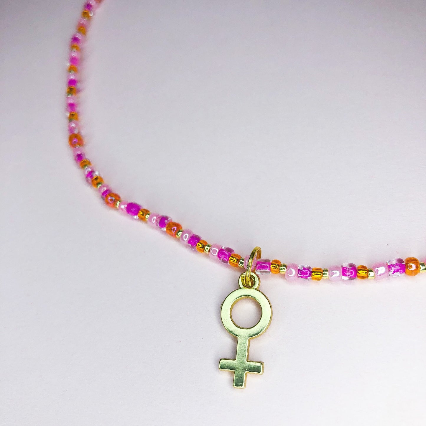 Pink Orange and Gold beaded necklace with gold venus charm