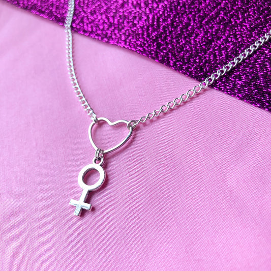Silver venus symbol charm and love heart necklace. Female symbol charm attached to love heart charm.