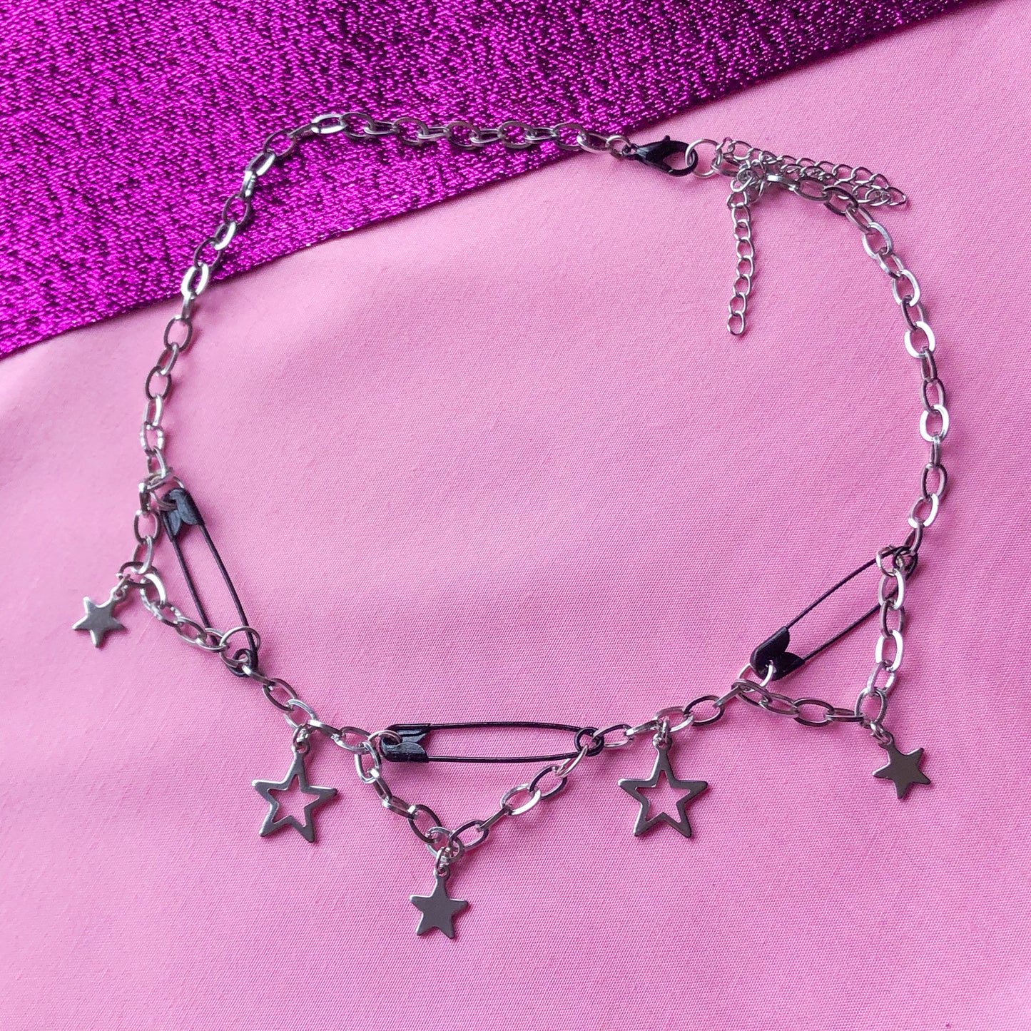 Black safety pin and star charm steel necklace