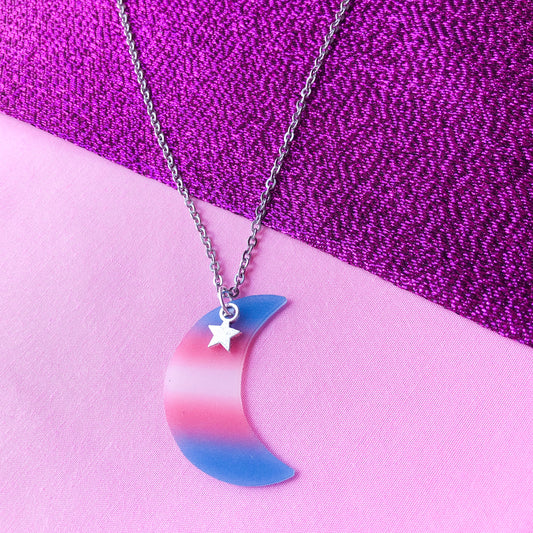 Transgender flag colours on a crescent moon charm attached to a stainless steel necklace chain