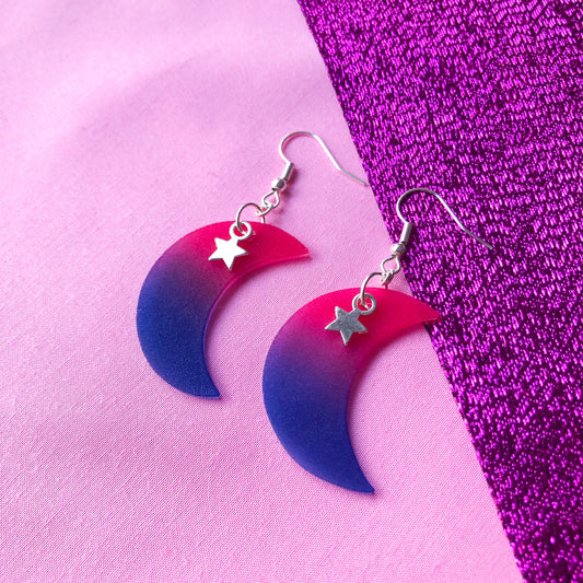 Crescent moon shrinky dink earrings in bisexual pride flag colours with a silver star charm at the top.