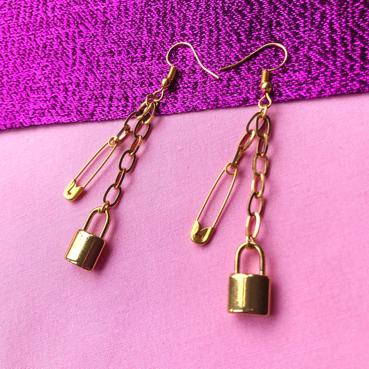 Gold locket and safety pin chain earrings